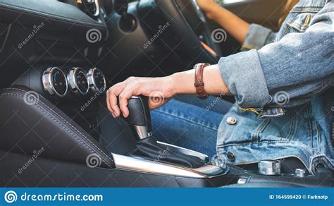 A Female Driver Shifting Automatic Gear Stick While Driving Car Stock