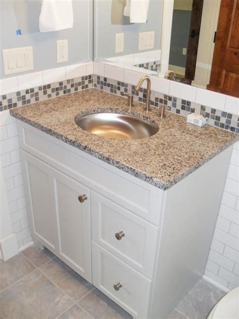 Such idea makes an individual's bathroom experience more inviting and luxurious. Transitional White Bathroom With Glass-Tile Backsplash | HGTV