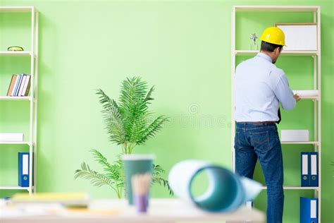 The Young Male Architect Working At The Project Stock Photo Image Of