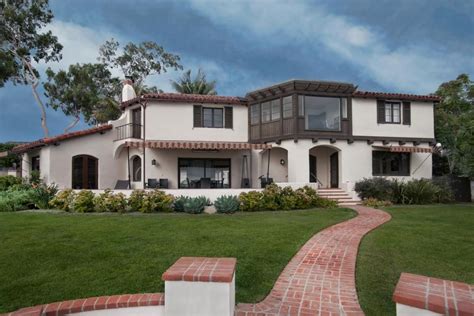 Maybe you would like to learn more about one of these? The back of this Spanish Colonial Revival home is designed ...