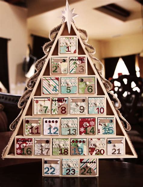 A Christmas Tree Made Out Of Wooden Blocks With Numbers On The Front