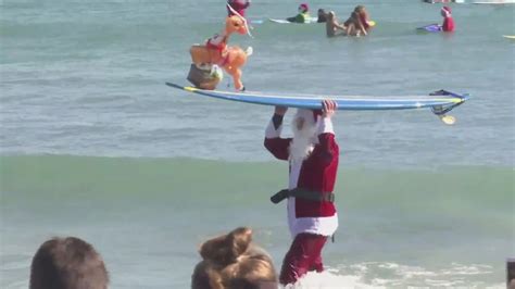 Hundreds Of Santas Were Catching Waves In Florida Yesterday As Part Of