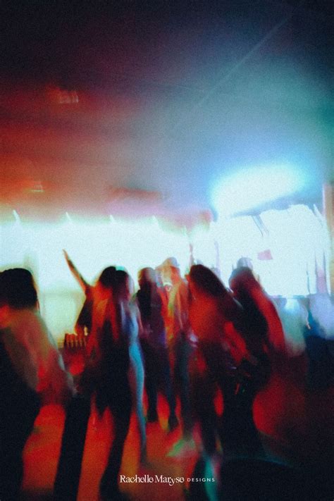 photograph of girls dancing on the dance floor at a nightclub blurry and grainy aesthetic red