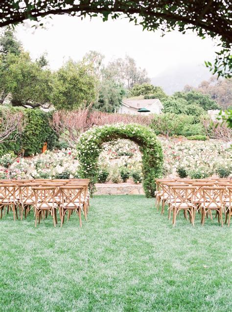 Wedding Arch Covered In Greenery