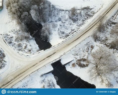 Aerial View Of Forest And River Covered With Snow Bird`s Eye V Stock