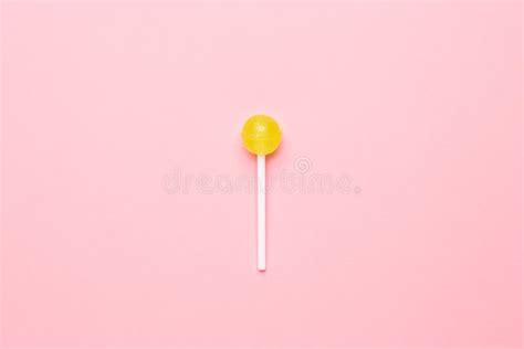 Sweet Yellow Candy Lolipop On Pastel Pink Backgroundminimalist