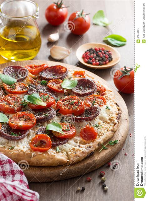 Italian Food Pizza With Salami And Tomatoes Vertical
