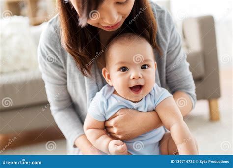 Close Up Of Mother With Little Baby At Home Stock Image Image Of