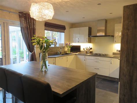 Gloss Ivory Kitchen With Jackson Pine Cabinets The Gallery Fitted