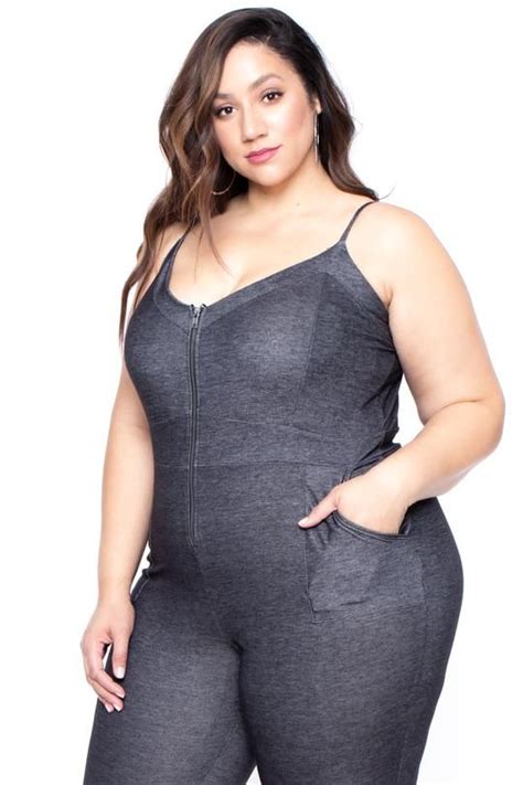 this plus size stretch denim knit jumpsuit features a scoop neckline an exposed front zi