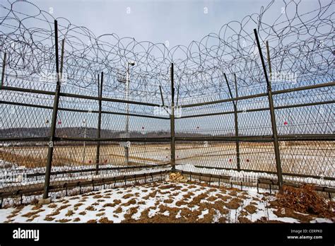 Barbed Wire Fence And South Korean Flag At The Dmz De Militarised Zone