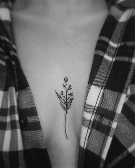 You can get the outline of a rose in black ink, or detailed so that it looks similar to an actual rose. Eux | #ink #tattoo #sternum #floral #flower #dainty # ...