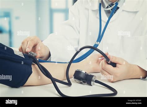 Doctor Measures The Pressure Of The Patient Doctor Patient Blood