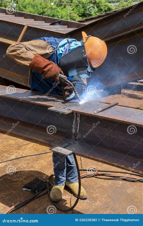 Welder Is Welding Add Joint H Beam For Steel Structure Work With
