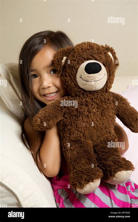 Cute Little Girl Hugging Her Bear Stock Photo Alamy