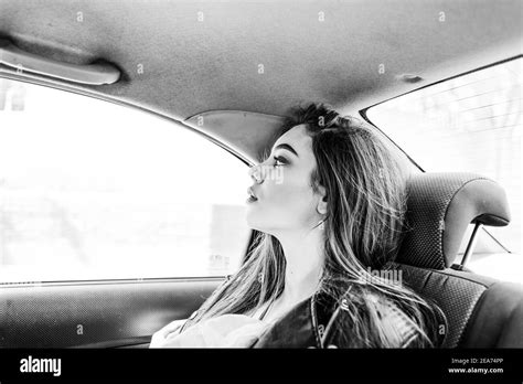 Girl In The Back Seat Of The Car Brunette In Car Beautiful Young Girl Rides In A Taxi Stock