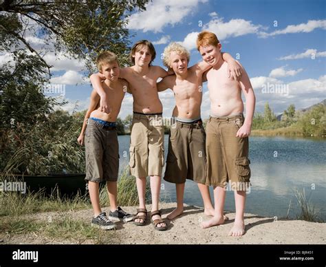 Four Boys Playing By A Lake Stock Photo Alamy