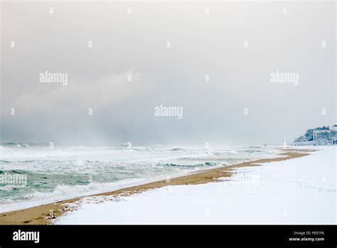 Snow On The Beach On A Windy Winters Day Stock Photo Alamy