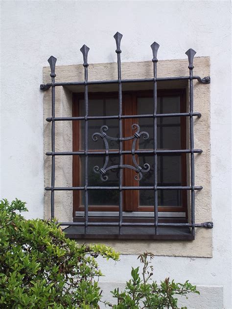 Traditional Window With Mighty Iron Cast Grid Window Security Bars