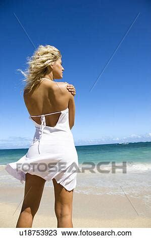 Stock Photo Of Portrait Of Pretty Blond Woman Standing On Maui Hawaii Beach Looking Out Towards