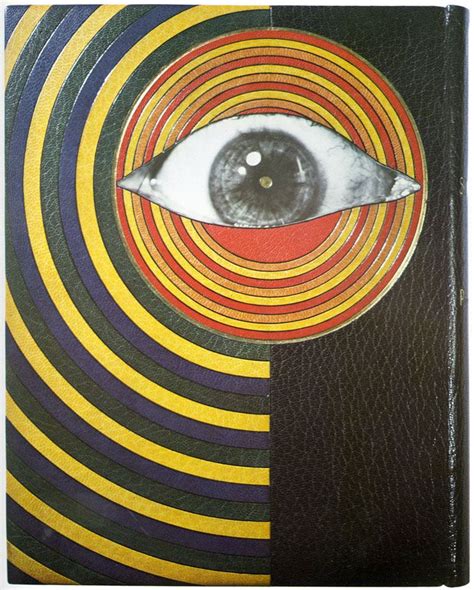 A Book With An Eye In The Center And Stripes On Its Front Cover