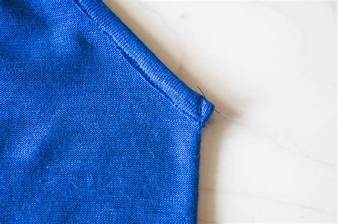 Stitch center back seam from neckline to hem and. HOW TO SEW KNIT BINDING ON A V OR MITERED NECKLINE ...