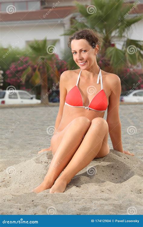 Woman In Bikini Sitting On Beach And Smiling Stock Photo Image Of Portrait Look