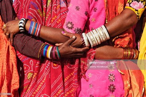 Women In Traditional Indian Clothing Hugging Photo Getty Images