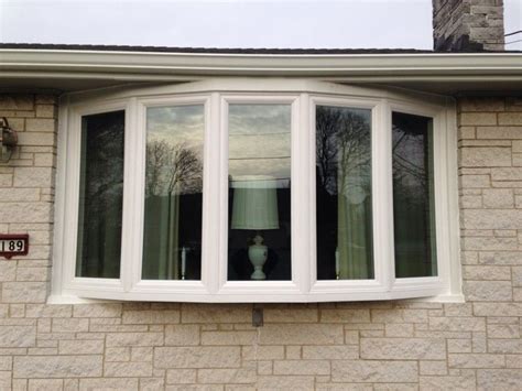 Five Series Of Bow Windows With Glass Panels And White Window Trims Of