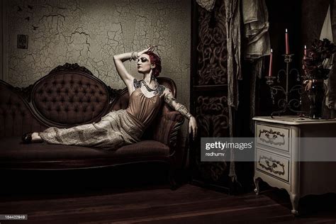 Elegant Retro Woman Lounging On Couch Bildbanksbilder Getty Images