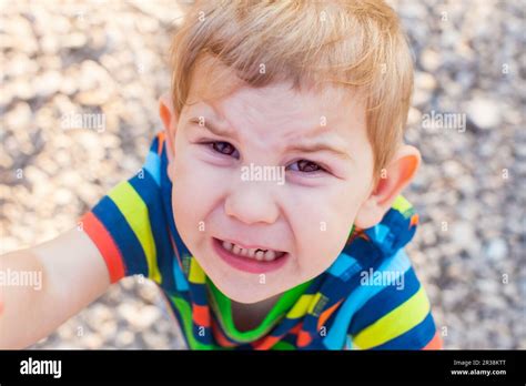 Emotional Baby Face Crying Kid Wants To Go On Hands Of Parent Stock