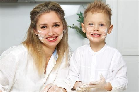 Premium Photo Happy Mom And Babe In White Kitchen Smeared Face With Flour