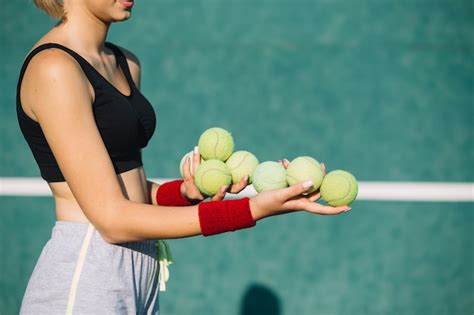 Free Photo Gorgeous Woman Holding Tennis Balls