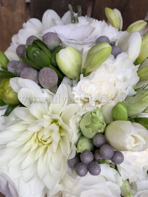 Garden roses, snapdragons, queen anne's lace, olive, astilbe, privet berries, star of. White and silver bouquet with silver brunia berries, by ...