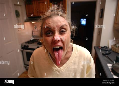 Funny Woman With Long Tongue Sticking Out Stock Photo Alamy