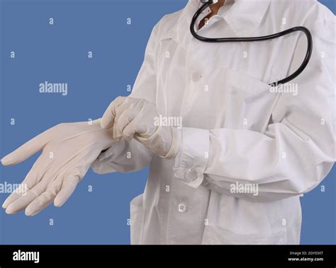 Female Doctor Putting On Latex Gloves Stock Photo Alamy