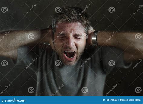 Dramatic Portrait Of 30s To 40s Desperate And Depressed Man Screaming