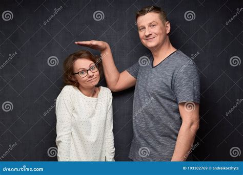 Shot Of Funny Tall Man And Short Woman Stock Image Image Of Hand People 193302769