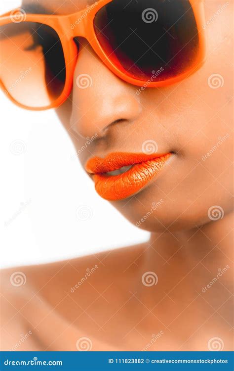 Closeup And Selective Focus Photograph Of Woman Wearing Orange Framed