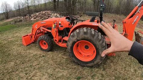 Kubota L4701 And Bh92 Backhoe Stripping Topsoil And Digging Rocks Field