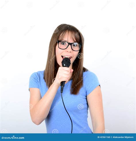 Portrait Of A Young Female With Microphone Against White Background