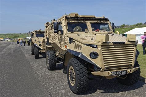 A Pair Of Army Infantry Foxhound Armoured Patrol Vehicles Parked Up At