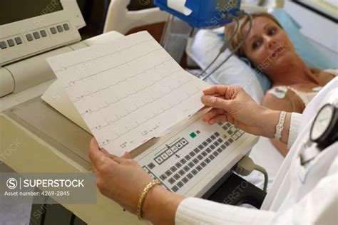 38 Years Old Female Patient Undergoing An Electrocardiography EKG
