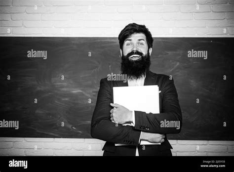 Young Bearded Teacher Near Chalkboard In School Classroom Good