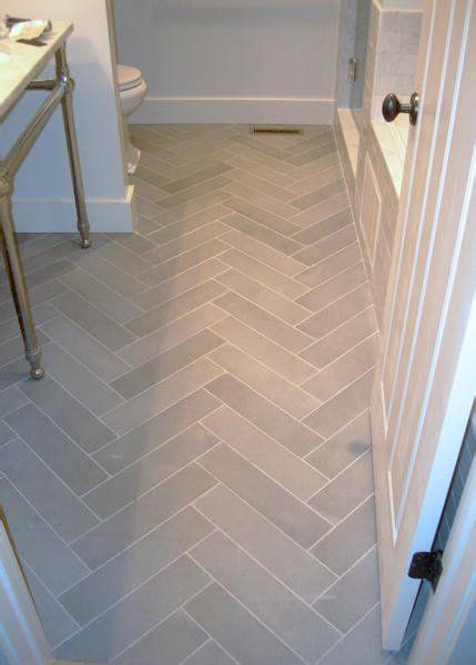 Pass a straightedge tool or piece of scrap lumber with a straight edge over the surface of the bathroom floor. gray herringbone tile | FollowPics | Bathroom flooring ...