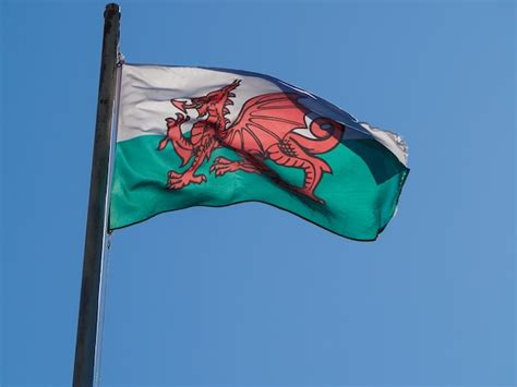 Premium Photo Welsh Flag Of Wales Over Blue Sky