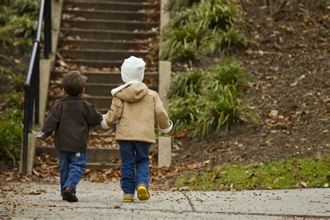 Two Toddlers Walking Towards Stairs Photo Free Apparel Image On Unsplash