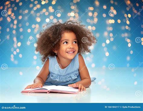 Smiling Little African American Girl Reading Book Stock Image Image