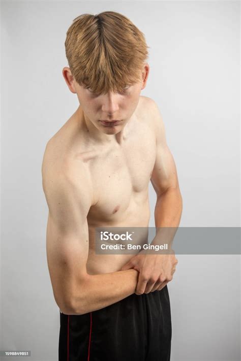 Teenage Boy Flexing His Muscles Stock Photo Download Image Now 14