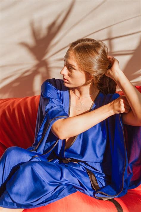 Beautiful Girl In Blue Silk Robe Resting In The Sunlight Stock Photo Image Of White Silk